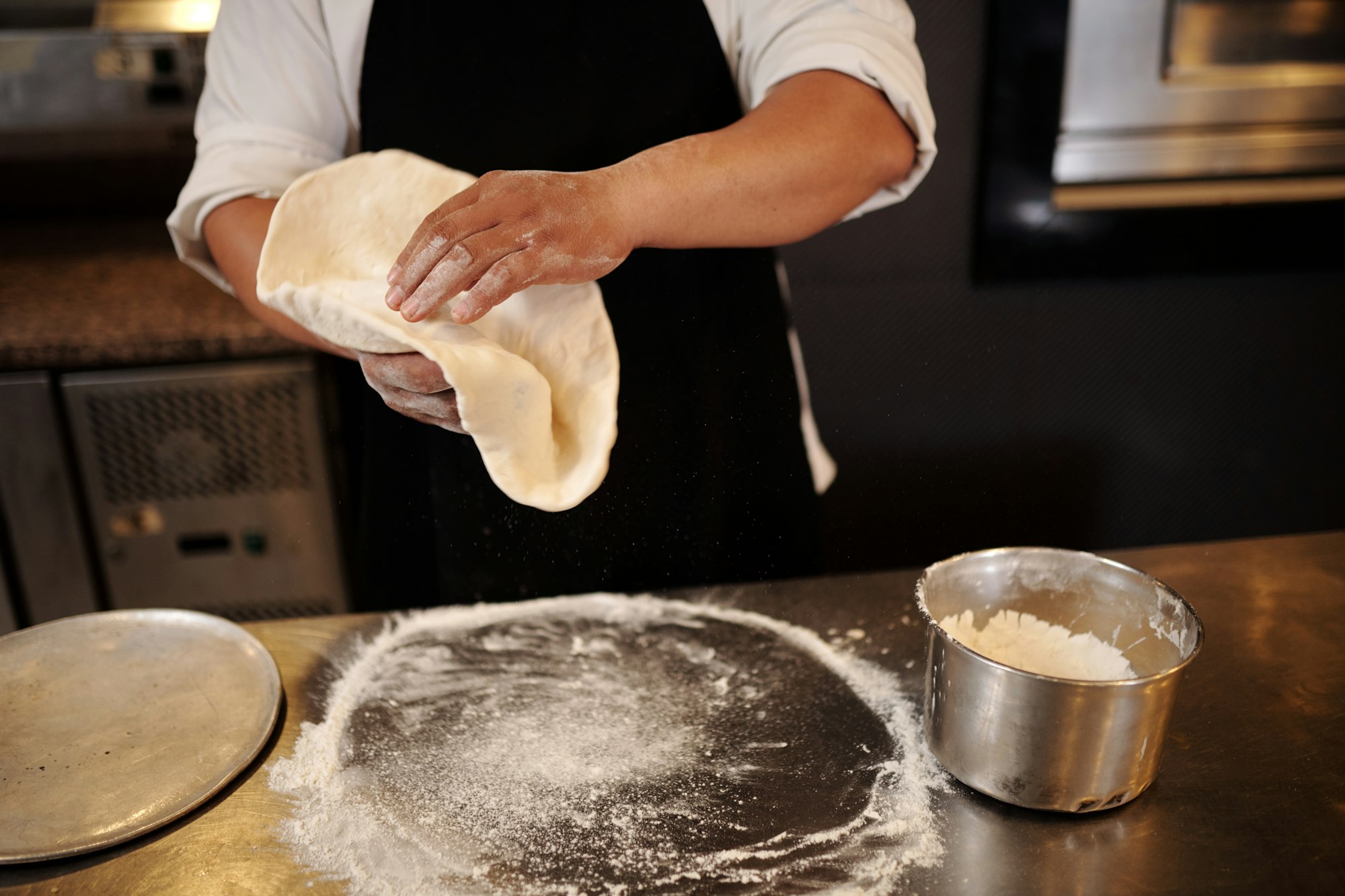 Pizza Maker Tossing Dough